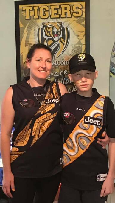 Eli Chatfield with his mum Sarah. Eli was first diagnosed with cancer in 2017, and recently had a recurrence.