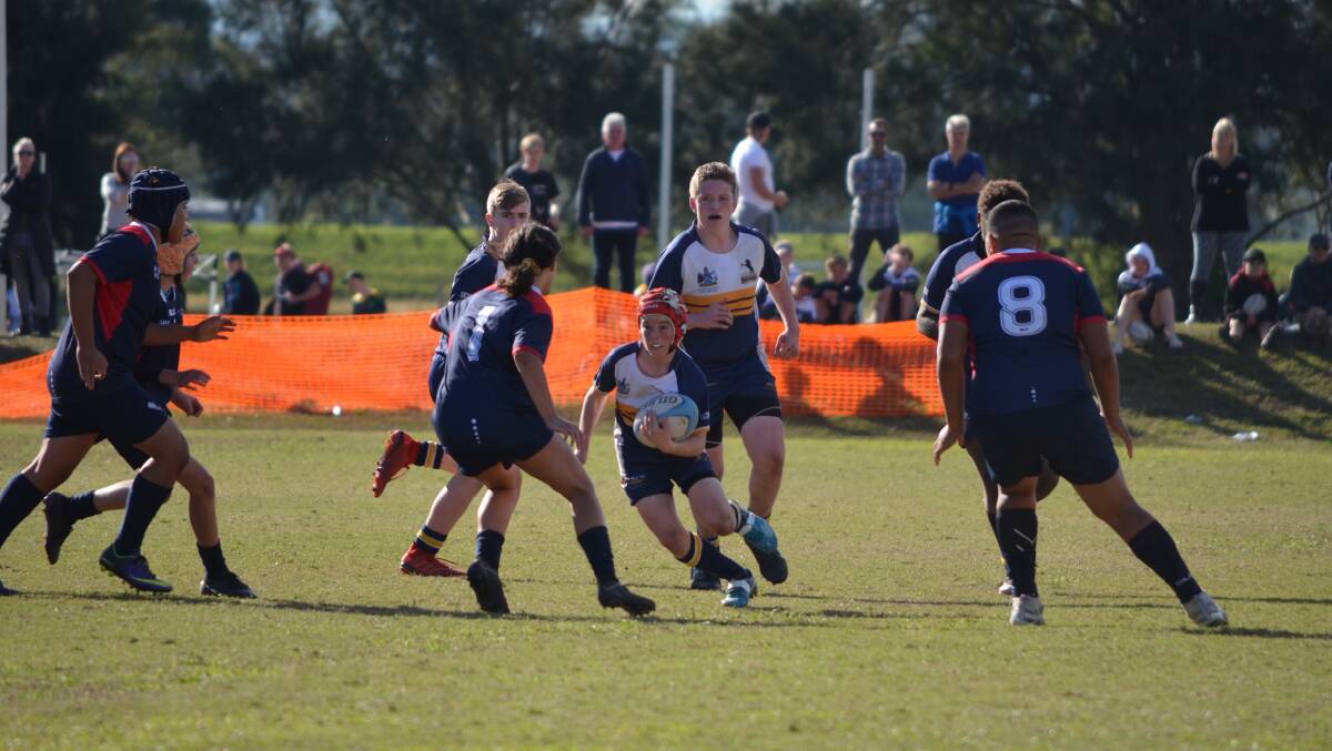 TOUGH: Lachlan 'Nugget' Collier runs the ball during the ACT Brumbies' 19-10 win over Victoria in the grand final of the NSW State Championships. Photo: Ronnie Collier.