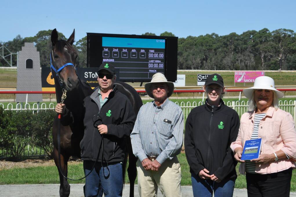 Tuross-Head historian Carlene Winch-Dummett Ph.D. (right) has written a book on the early history of the Moruya Jockey Club. She's pictured with Resort, trainer Luke Jarvis, chairman Peter Atkinson, and trainer Natalie Jarvis.