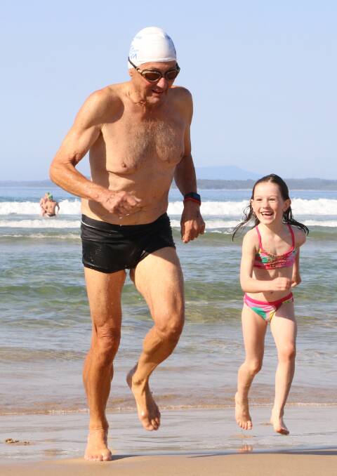 CHEERLEADER: This man had one very proud granddaughter during the Broulee Bay to Breakers Ocean Swim in March.