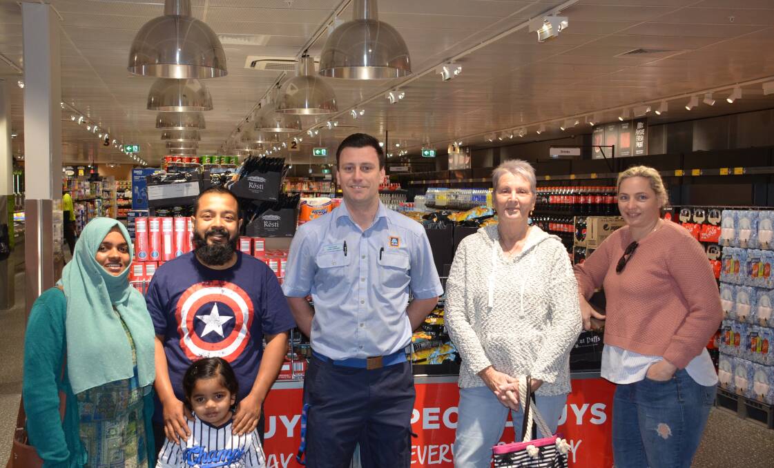 Shadiya NK, Moosa Kutty, Liyan Zaira, Michael McCarron, Sue Curby, and Tess Gallen in the newly refurbished Aldi store in Batemans Bay.