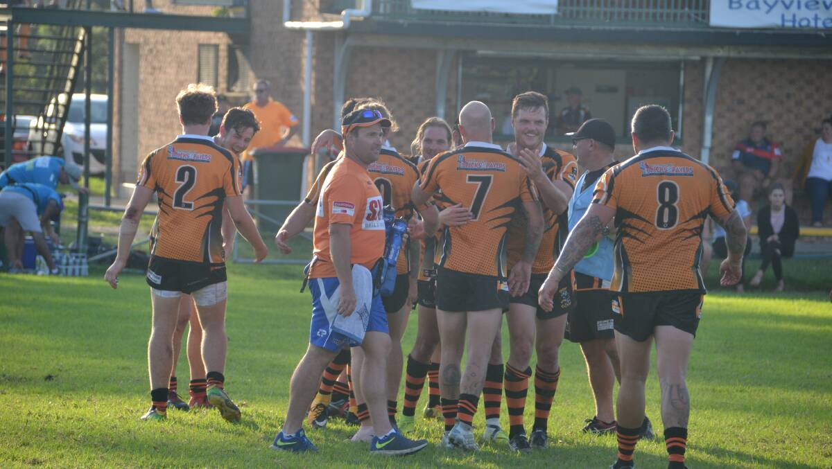 The Batemans Bay Tigers celebrate their 32-18 victory over the Bega Roosters. It's the Tigers first win since Round 12, 2015.