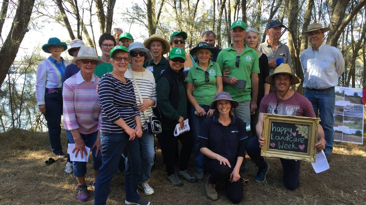 Some of the shires Landcare volunteers gathered on the banks of the Moruya River for some celebratory cake during National Landcare Week.