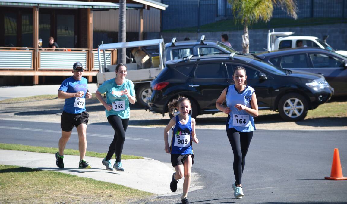 RAISING FUNDS: More than 300 runners competed in the Moruya Town to Surf Fun Run, with over $5000 being raised for the club.