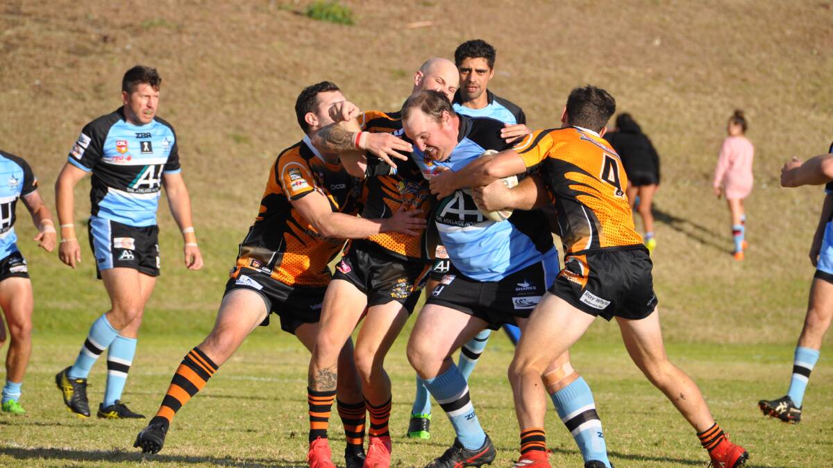 HIT UP: Sharks captain Tim Weyman struggles through the Batemans Bay defence in Moruya's last home game on Sunday, May 12.