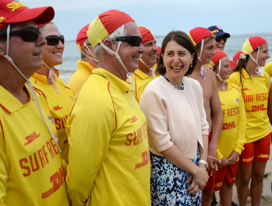 NSW Premier Gladys Berejiklian with lifesavers at Cronulla beach on Sunday, announcing Surf Life Saving NSW will receive an extra $16 million in funding over four years. Picture: Jeremy Piper/AAP