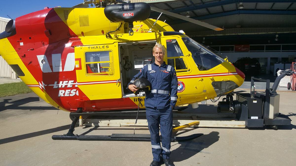 NEW RECRUIT: Mitchel Van der Meulen in front of the Westpac Life Saver Rescue Helicopter.