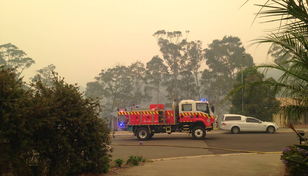 LIFESAVERS: A NSW RFS crew arrives at 2.21pm to protect people and property. PHOTO: Sharon Halliday