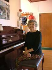 QUEEN OF THE KEYBOARD: Gwen Wray at home with her beloved Schimmel piano, the only new piano she has ever been able to afford.