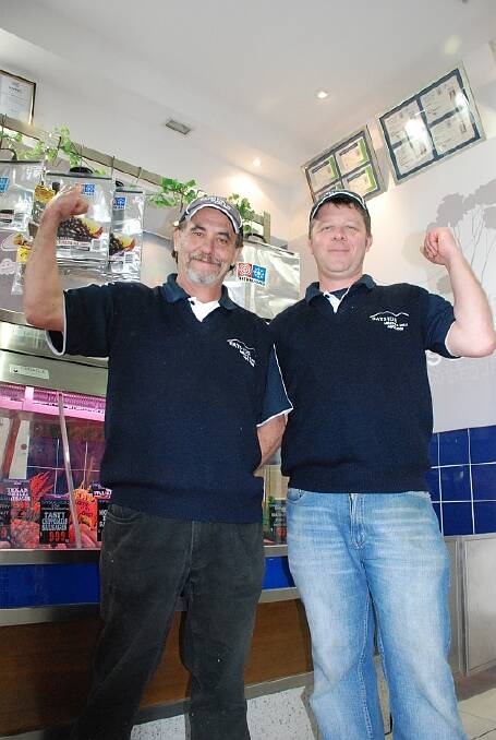 BEEFCAKES:  Bayside Meats and Deli workers Ricky Beaves and Scott Thornton ham it up for the cameras.