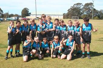 TERRIFIC TWELVES: The Batemans Bay Seahawks under 12 premiership team with the spoils of victory on Sunday - Peter Griffiths, Jayden Lipton, Mitchell Fulcher, Lochie Kornman, Clayton O’Brien, Charlie Hall, Jarred Thompson, Lachlan McBride, Jesse Chapman, Lachy Fulcher, Michael Thane, Lochie Mullins, Daniel Gulliver, Brodie Coackayne, Liam Nelson, Harrison Clout and Rory McDonald.
