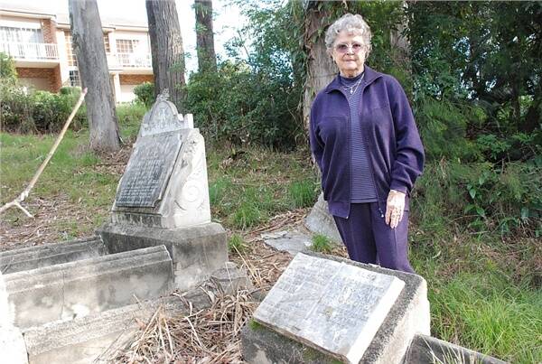 HISTORIC SITE:  Batemans Bay resident Betty Murdoch at her grandparents’ graves, which are in a heritage-listed gravesite off Hill St.