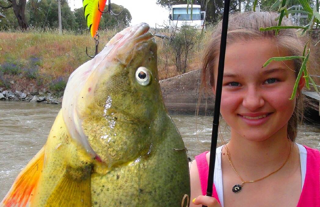 BIG SURPRISE: Caitlin Paxevanos found out just how good fishing next to an RV can be.